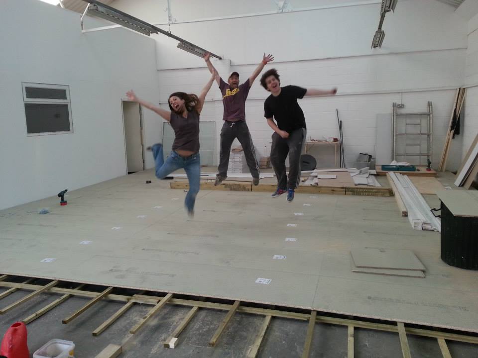 Dancers jumping for joy in the newly built studio