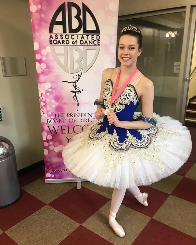 Ballet dancer in a blue and white classical tutu